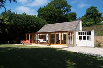 The bank behind the cottage has been planted with wildflowers and other cottage plants.