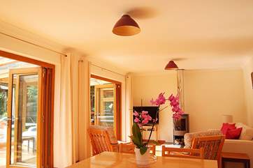 Doors out from the open plan living-room into the conservatory.
