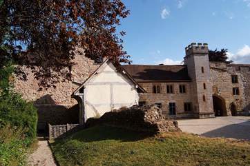 This is the courtyard setting with Castle House to the left of the tower - you can see the windows of the first floor living-room. In the foreground is a fully restored medieval Alms House.