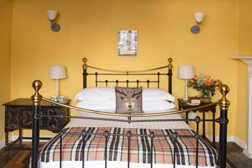 Stylish soft furnishings compliment the room.