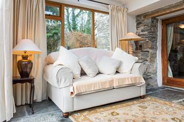 There's another comfy sofa in the conservatory