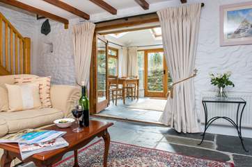 The sitting room leads into the conservatory