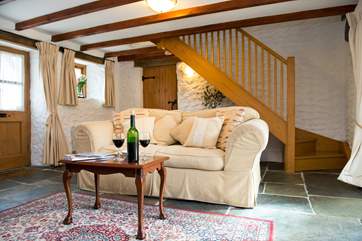 The stairs lead up from the lounge