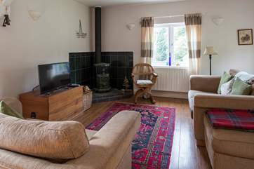 Cosy up around the wood-burner on cool evenings.