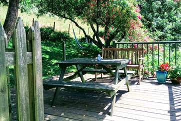 The patio is found outside the kitchen door with the meadow beyond. What a fabulous place to sit and dine al-fresco.