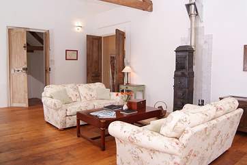 This welcoming cottage has an open plan living area with a Scandinavian wood-burner - there is a second sitting-room too.