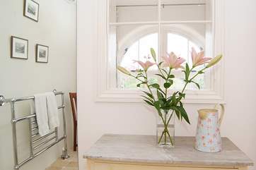 A pretty internal window from the bathroom to the dressing-room is a lovely feature.