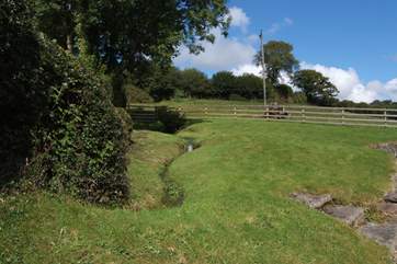 The main garden area is at the back of the cottage, complete with a little stream!
