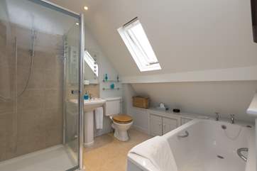As well as this family bathroom, with shower and bath, there is a downstairs cloakroom for additional convenience.