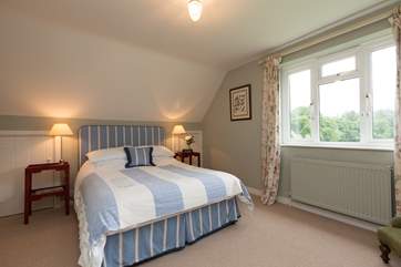 Upstairs there are two bedrooms - this is the double with its super comfy king size bed and views across the countryside.
