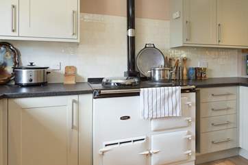 The Aga is the focal point of this lovely kitchen, adding that lovely extra warmth too.