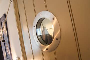 Porthole windows continue the nautical theme.