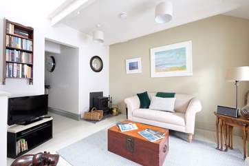 An open doorway leads to the kitchen.