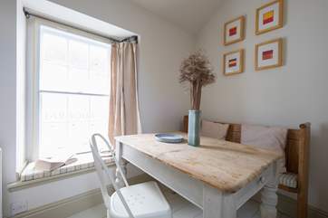 The dining-area with vintage scrubbed pine table.