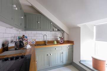 The kitchen has a sloping ceiling so please mind your head if you are tall.