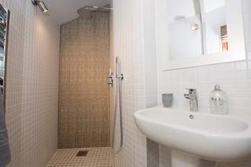 The is an en suite shower-room off of the bedroom area in the main yurt.
