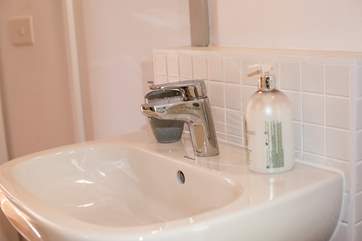 The shower-room includes a WC and wash-basin.