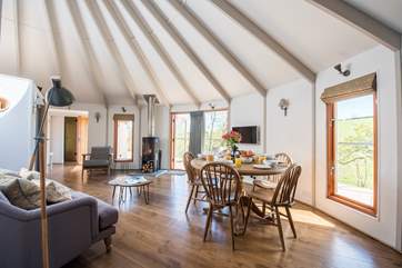 There is a huge 8 metre diameter living space in the large yurt and a triple bunk bedroom and en suite shower-room in the smaller yurt.