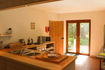 The open plan kitchen with doors onto the patio.