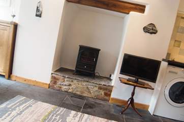 A wood-burner effect electric stove adds warmth and a focal point (without the effort!).