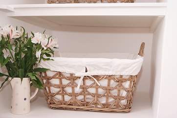 The original wall recesses have been used as a clever storage solution - though there is hanging space for clothes on the landing too.
