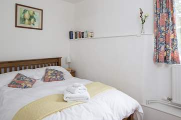 This bedroom has a double bed and looks out over the fields.