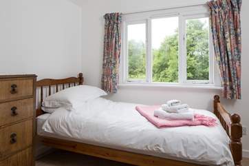 This is the single bedroom overlooking the garden. The cottage only accommodates four guests but gives you the flexibility of three bedrooms.