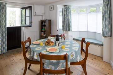The bay window and window seat look out towards the village and allow light to flood into the cottage.