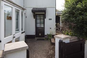 The gate from the lane leads to the back door and garden.