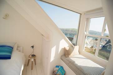 A lovely window seat to relax and read or look out over the lovely view.