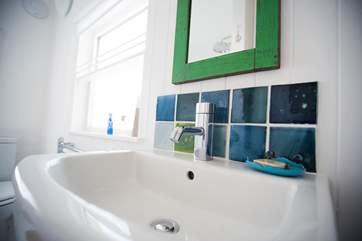 Handmade tiles above the bathroom basin.