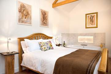 The gorgeous bedroom with its luxury bath