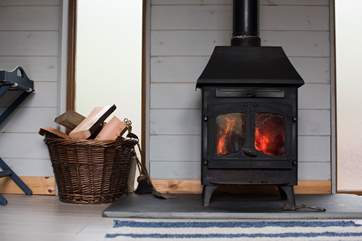 The wood-burner will keep you lovely and warm on those out of season months (logs are inclusive).