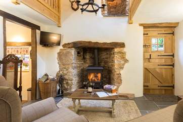 You step straight into this lovely living area with the kitchen to the left and the back door to the garden to the right.