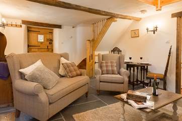 Looking back towards the front door, with the stairs leading up to the mezzanine level with the bedroom and shower room