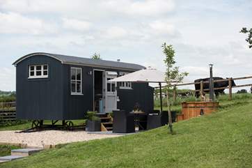 Otter's Holt with its wood-fired hot tub and patio area with fabulous countryside views.