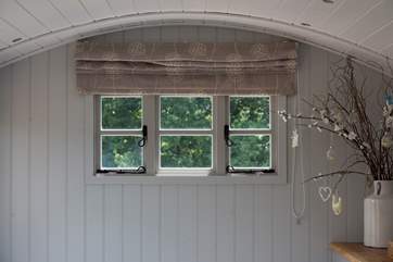 The picture window above the double bed.