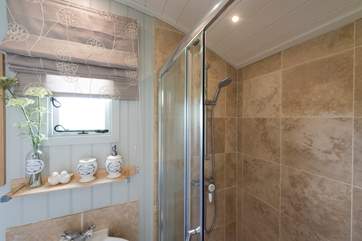 With hot shower, flushing toilet