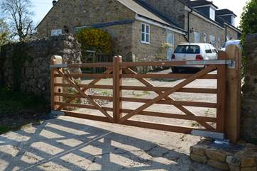 These electric gates are activated by driving on a magnetic cirucit beneath the concrete. The gates open towards you and will close automatically after 90 seconds. There is also a magnetic circuit the