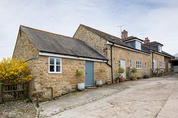 Badgers cottage is next door to Barn Owls cottage, Badgers is in the foreground.