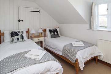 This twin room looks out over the farmyard; the whole upstairs is flooded with light.