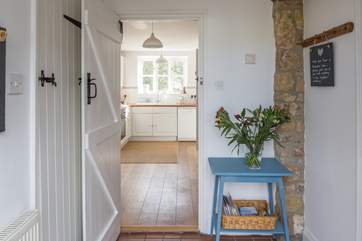 From the entrance hall, with the kitchen ahead and cloakroom to the left. Please mind the small step.
