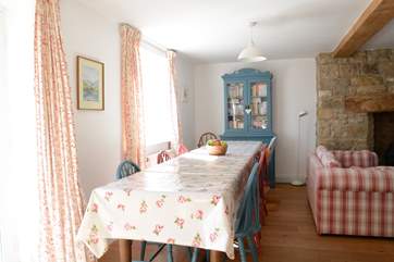 The sitting/dining-room has a wonderful refectory table that seats eight.