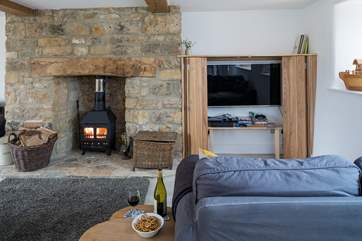 With a cosy wood burner and Smart TV for chilly evenings this open plan space is ideal for all the family.