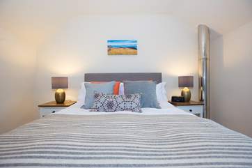 King-size bed in Bedroom 1.