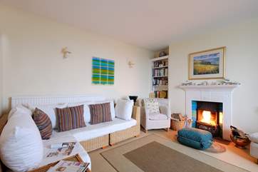 The sitting-room has an open fire.
