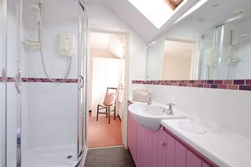 The shower-room has a door at either end giving direct access to both bedrooms.