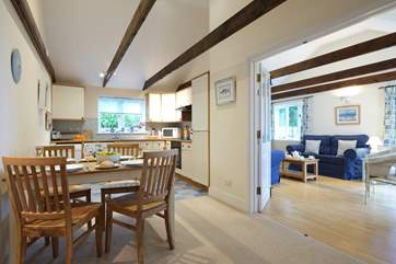 French doors from the dining area open through to the sitting room.