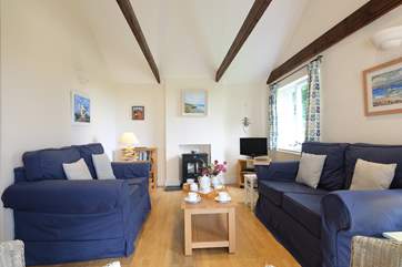 The sitting-room has a cosy woodburner.