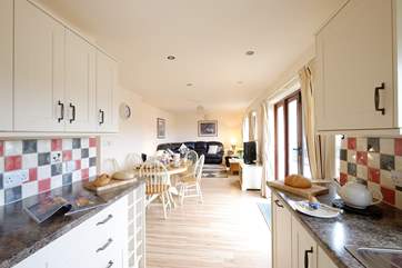 Looking towards the dining and sitting areas from the kitchen.